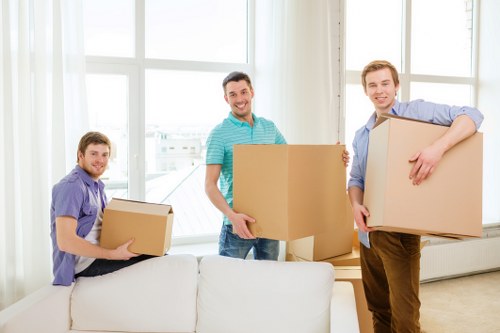 Professional removal truck crew arranging and loading belongings.