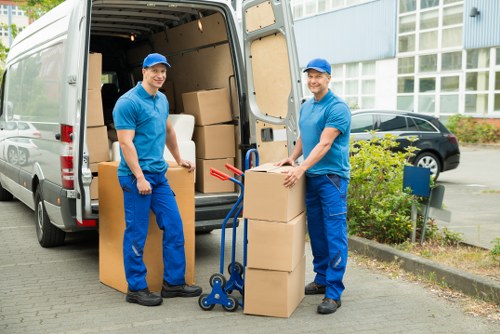 Workers loading a van during a small flat clearance in Balham