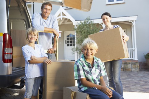 Professional movers carefully packing items